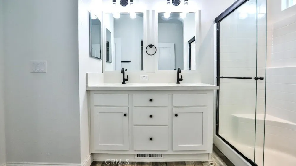 17700 Avalon, Unit 387 Carson, CA 90746 - Photo 16 of 28 a bathroom with a bathtub sink vanity and mirror