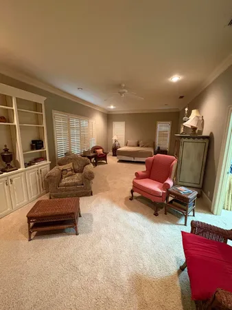 a view of a room with wooden floor and white walls