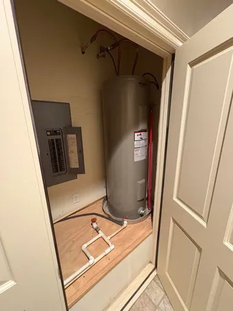 a hallway with a view of the bathroom