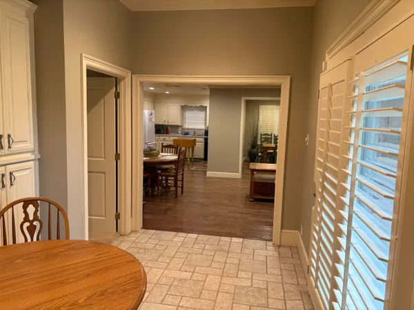 a kitchen that has a sink and a stove in it
