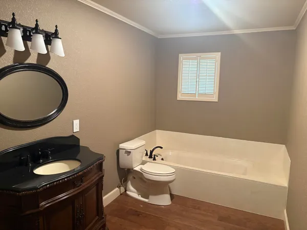 a bedroom with two beds and a chandelier