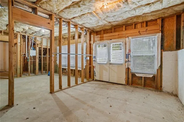 a view of an house with backyard space and balcony
