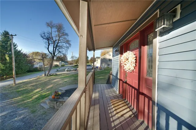 a view of a balcony with yard