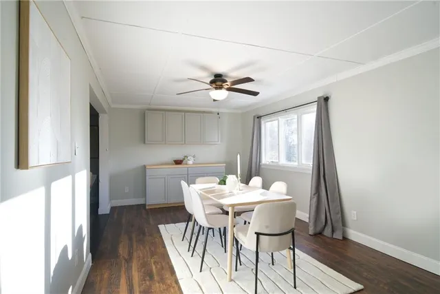 a dining room with furniture and window