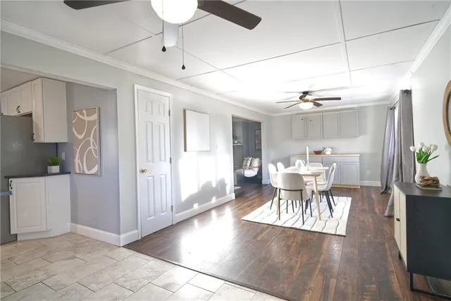 a view of a dining room with furniture and wooden floor