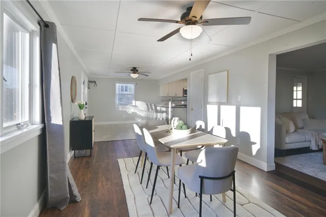 a view of a dining room with furniture window and wooden floor