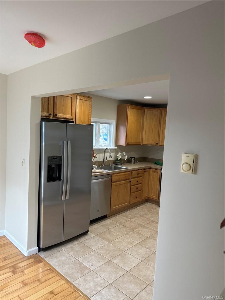 100 Dunderberg Road Putnam Valley, NY 10579 - Photo 27 of 29 a kitchen with a refrigerator and a stove