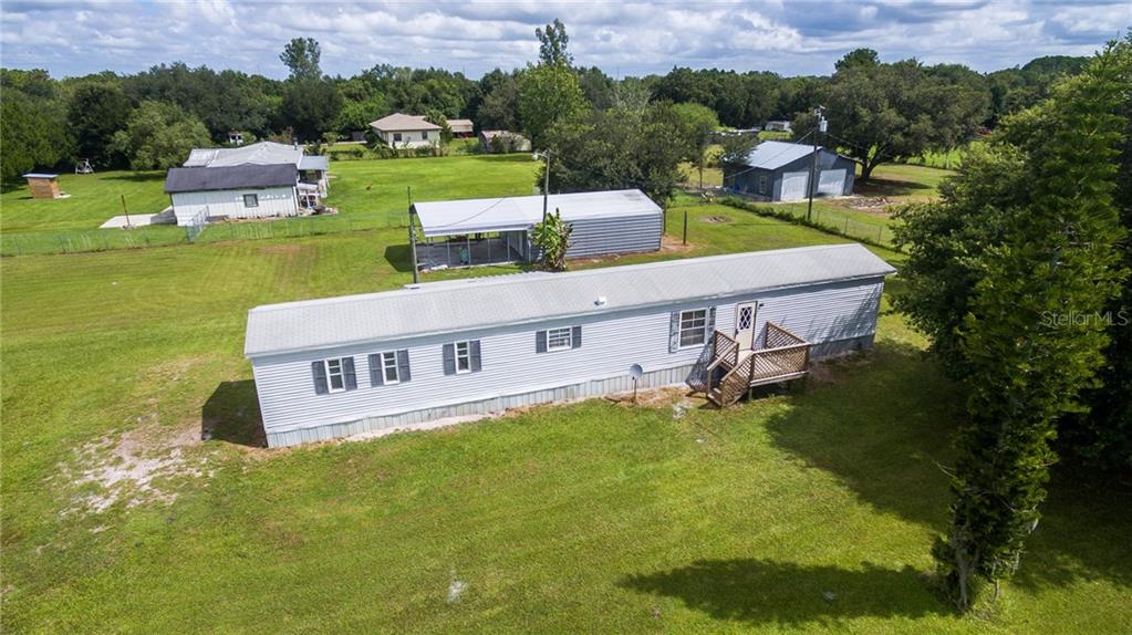 3987 Rambler Avenue St. Cloud, FL 34772 - Photo 1 of 1 Front of home with workshop