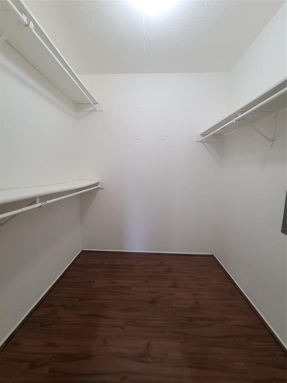 5644 Perrin Street The Colony, TX 75056 - Photo 15 of 16 Spacious closet with dark wood-type flooring