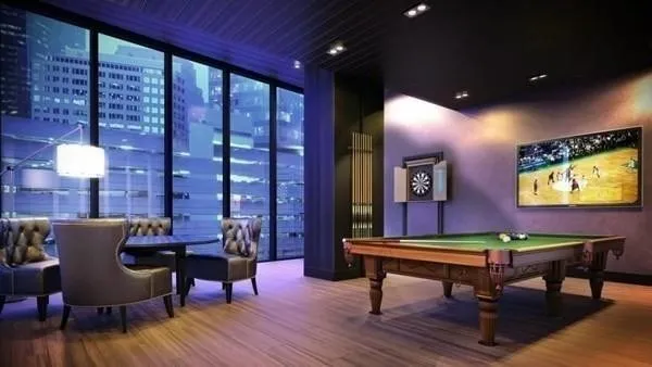 a room with furniture pool table and windows
