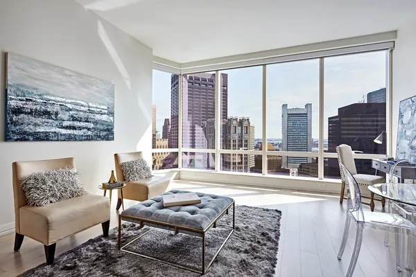 a living room with furniture and a large window