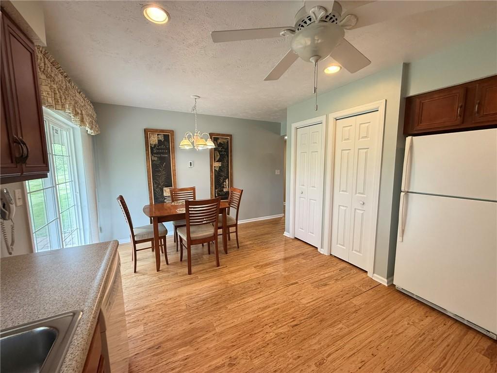 411 Chestnut Lane Apollo, PA 15613 - Photo 6 of 38 a view of a dining room with furniture and a chandelier