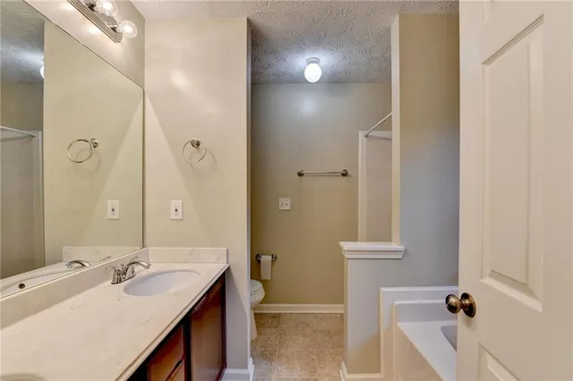 a bathroom with a double vanity sink and mirror with shower