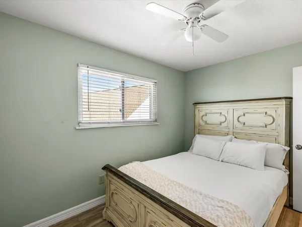 a bedroom with a bed and window