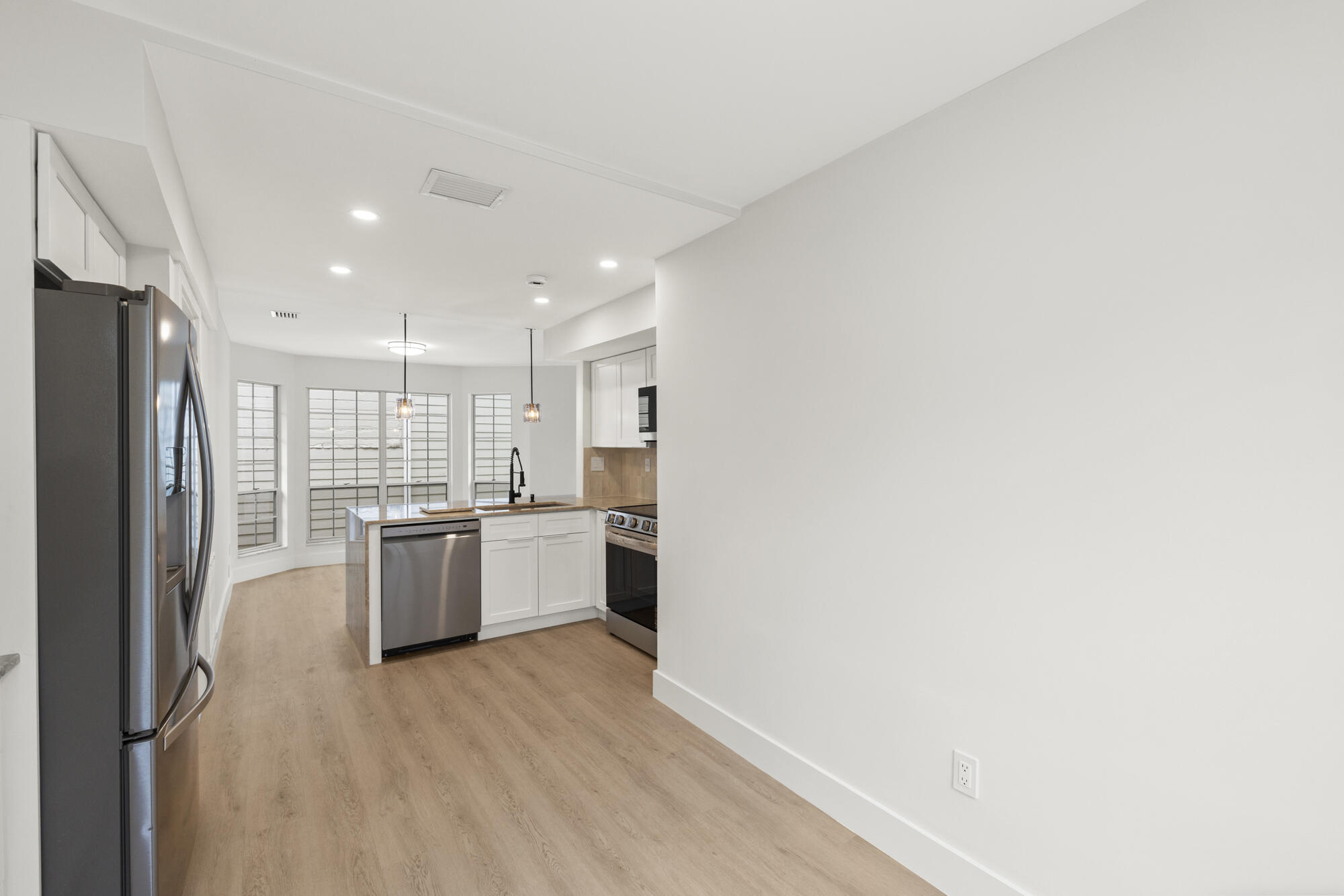 5115 Coronado Ridge Boca Raton, FL 33431 - Photo 11 of 31 a kitchen with a refrigerator and a sink
