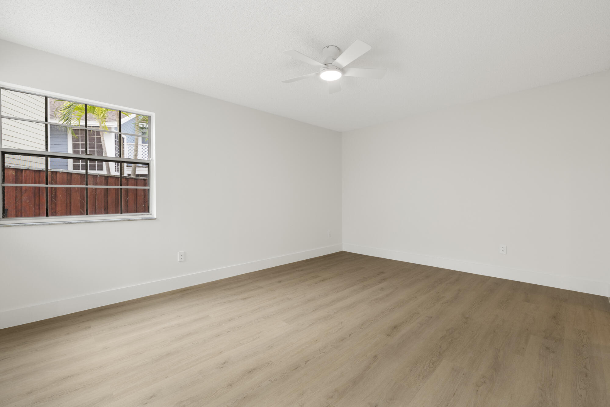 5115 Coronado Ridge Boca Raton, FL 33431 - Photo 13 of 31 an empty room with a window