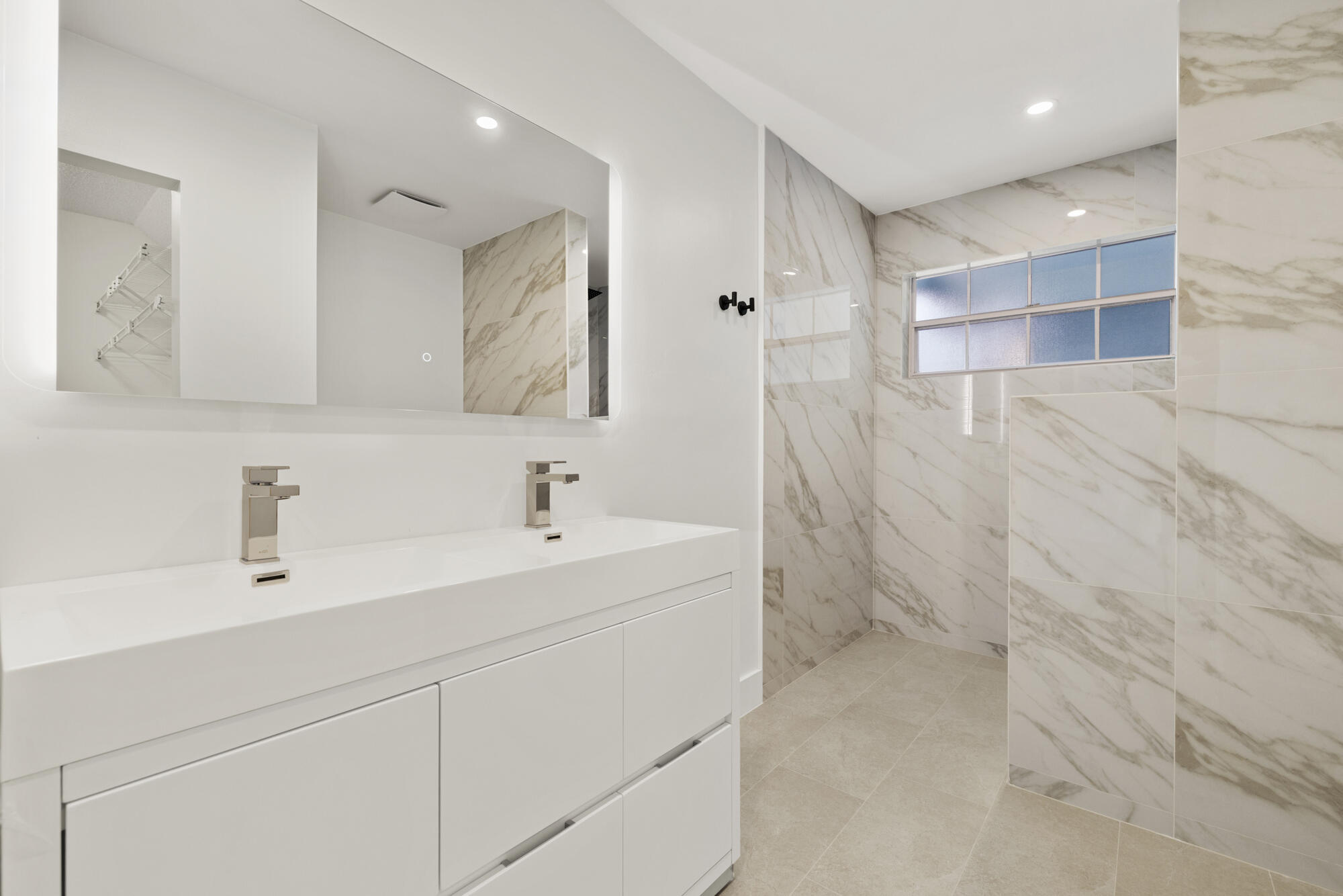 5115 Coronado Ridge Boca Raton, FL 33431 - Photo 14 of 31 a bathroom with a sink a toilet and a mirror