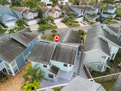 an aerial view of a houses with yard