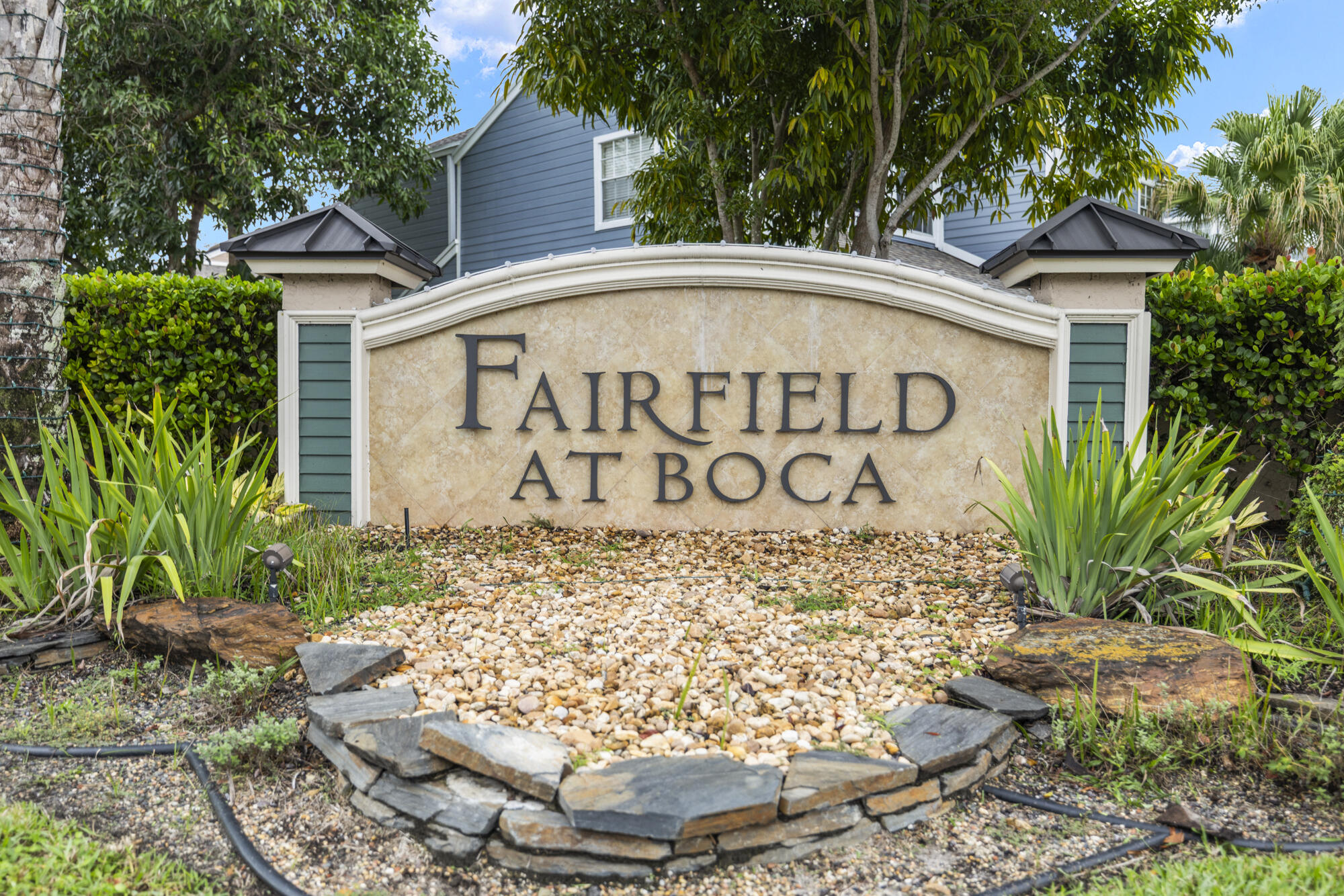 5115 Coronado Ridge Boca Raton, FL 33431 - Photo 27 of 31 a sign on the side of a building