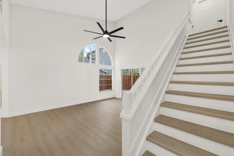 a view of staircase with white walls