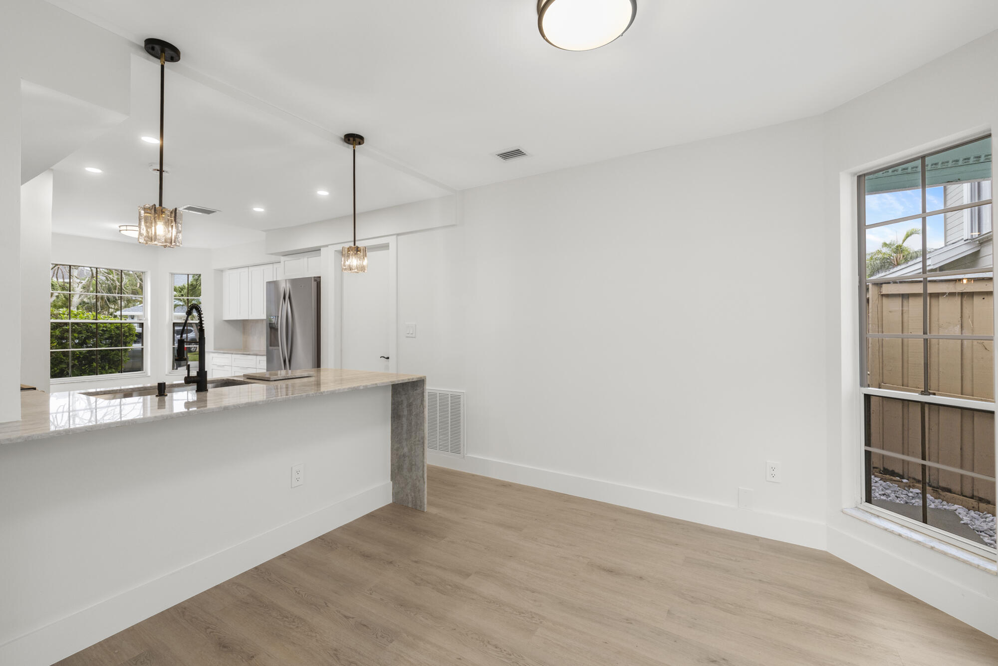 5115 Coronado Ridge Boca Raton, FL 33431 - Photo 6 of 31 a view of a kitchen with furniture and window