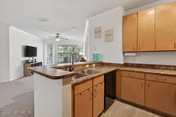 a bedroom with a bed and flat screen tv