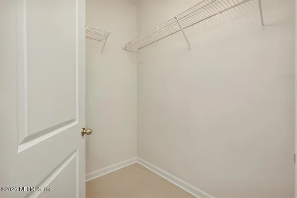 a bathroom with a bath tub with a shower
