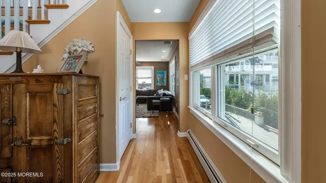 a view of a balcony with furniture and floor to ceiling window
