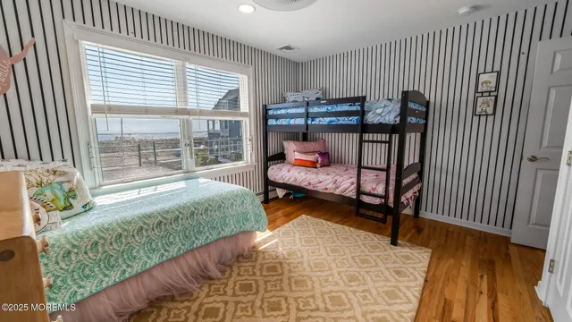 a bedroom with furniture and a window