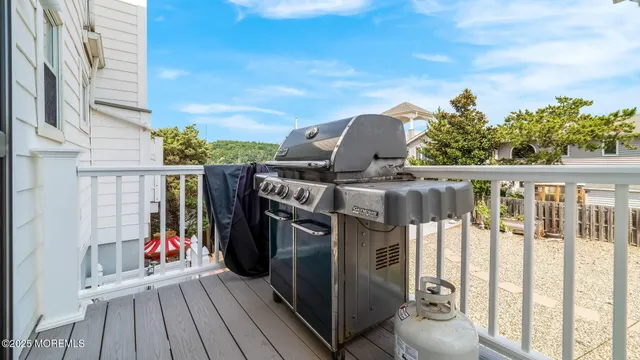 a view of outdoor space with deck and furniture