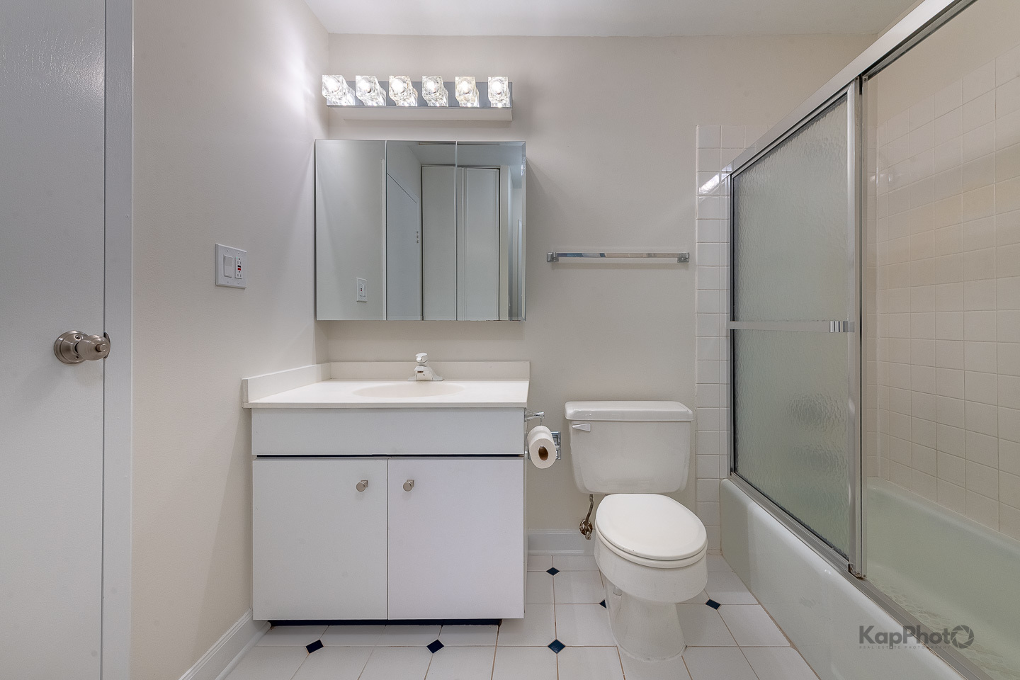 120 Lakeview Drive, Unit 318 Bloomingdale, IL 60108 - Photo 20 of 31 a bathroom with a toilet a sink and a shower