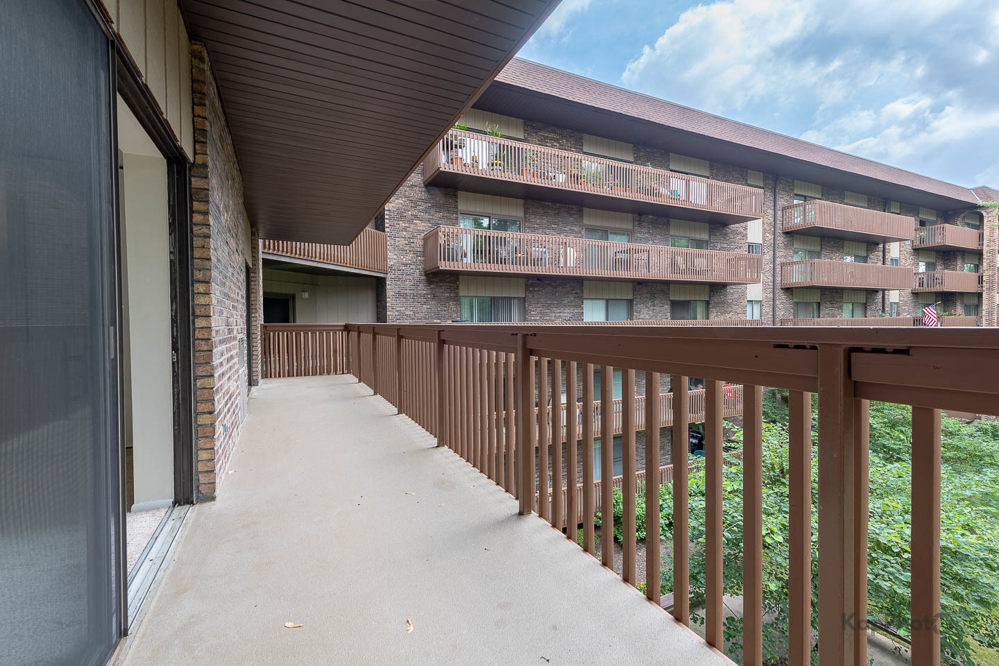 120 Lakeview Drive, Unit 318 Bloomingdale, IL 60108 - Photo 24 of 31 a view of a building from a balcony
