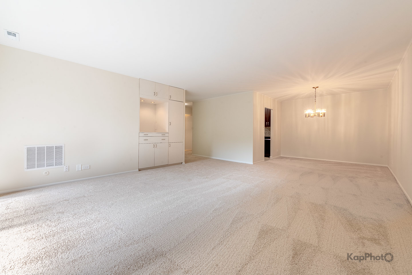 120 Lakeview Drive, Unit 318 Bloomingdale, IL 60108 - Photo 6 of 31 an empty room with a empty space and windows