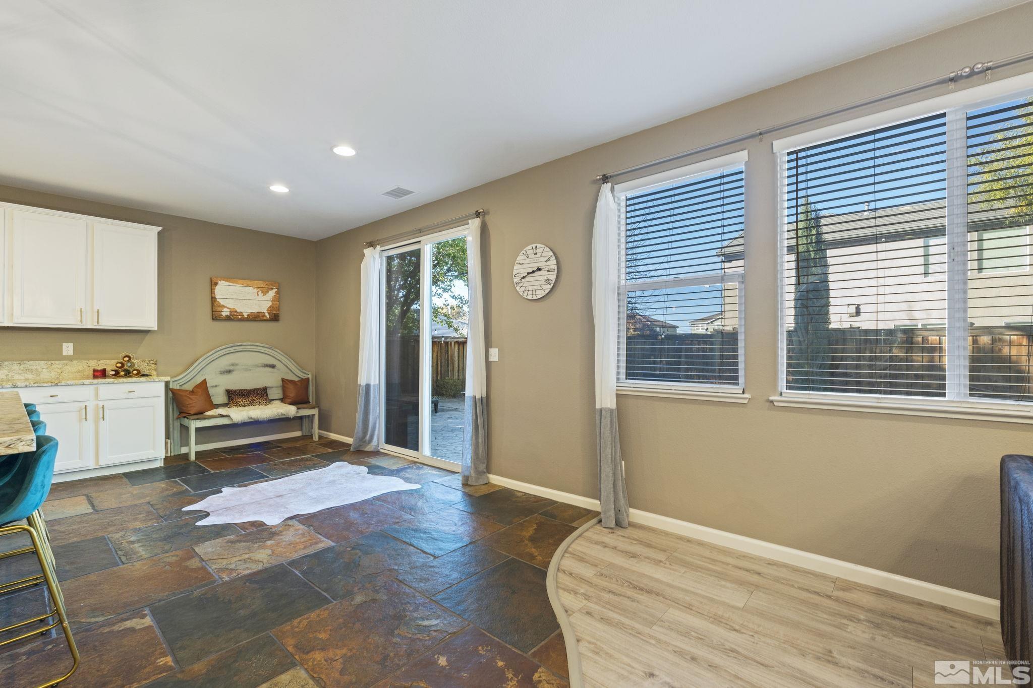 405 Teramo Court Reno, NV 89521 - Photo 13 of 40 a bedroom with a bed and a large window