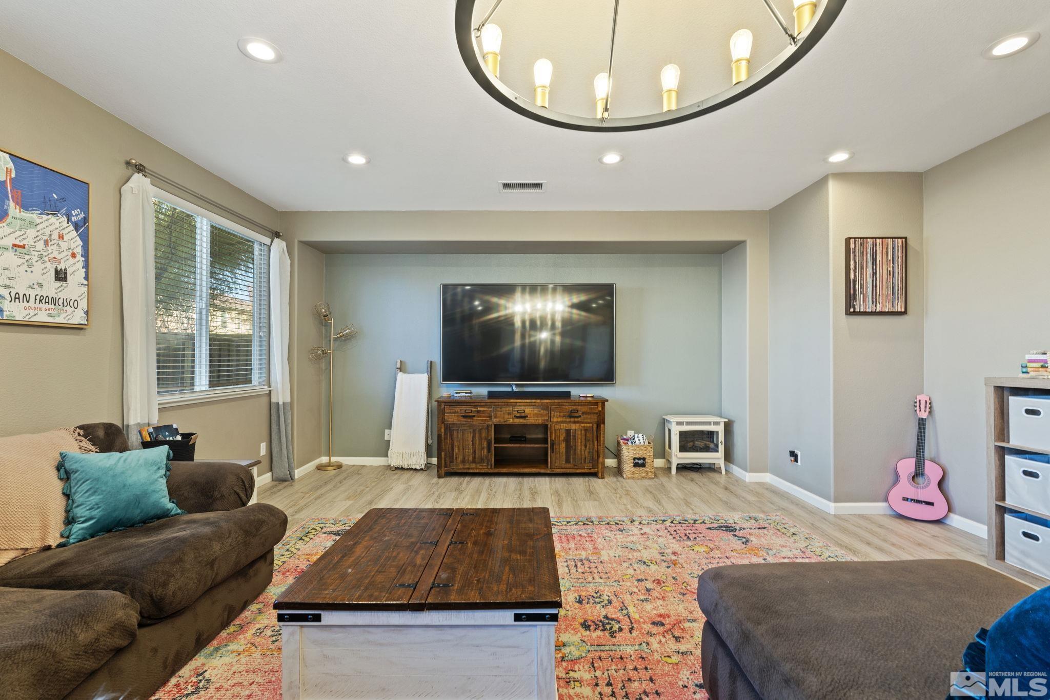 405 Teramo Court Reno, NV 89521 - Photo 15 of 40 a living room with furniture and a flat screen tv