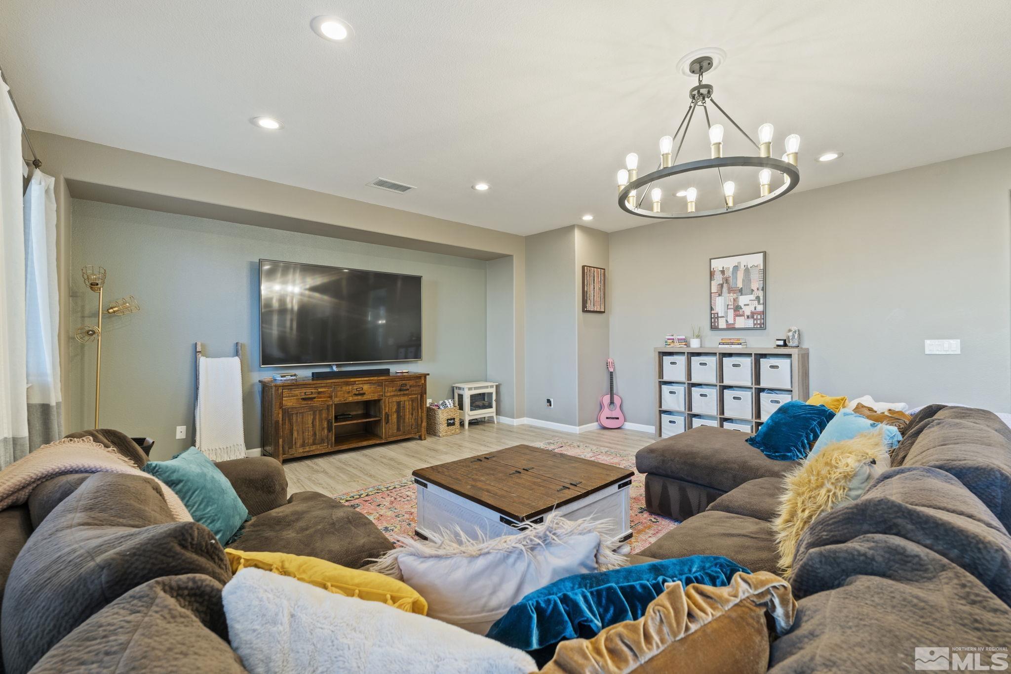 405 Teramo Court Reno, NV 89521 - Photo 16 of 40 a living room with furniture kitchen and a flat screen tv