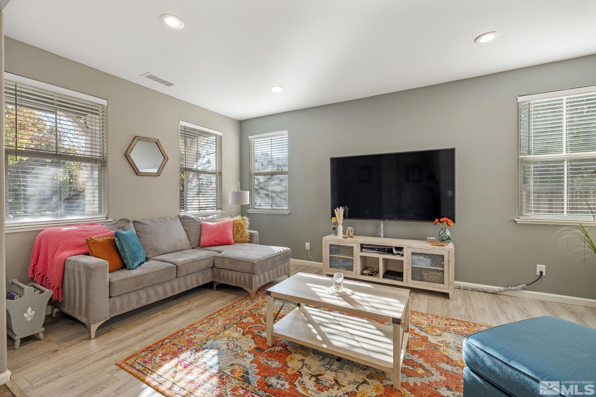 405 Teramo Court Reno, NV 89521 - Photo 2 of 40 a living room with furniture and a flat screen tv