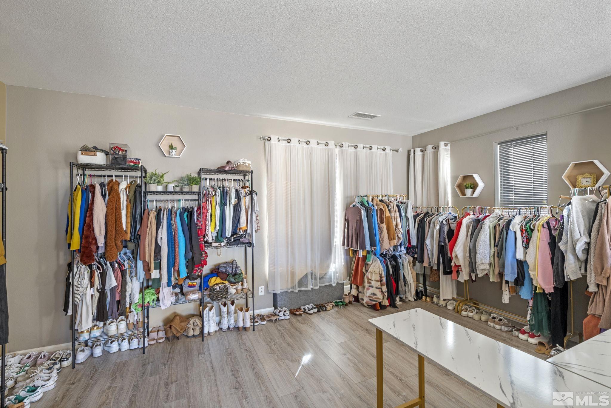 405 Teramo Court Reno, NV 89521 - Photo 21 of 40 a view of walk in closet with clothes