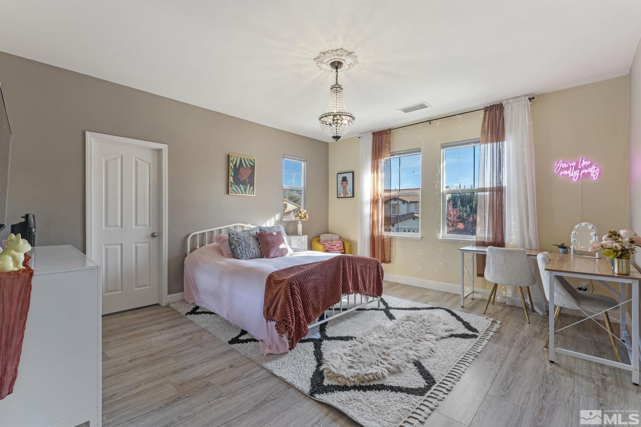 405 Teramo Court Reno, NV 89521 - Photo 24 of 40 a bed room with a bed and a chair