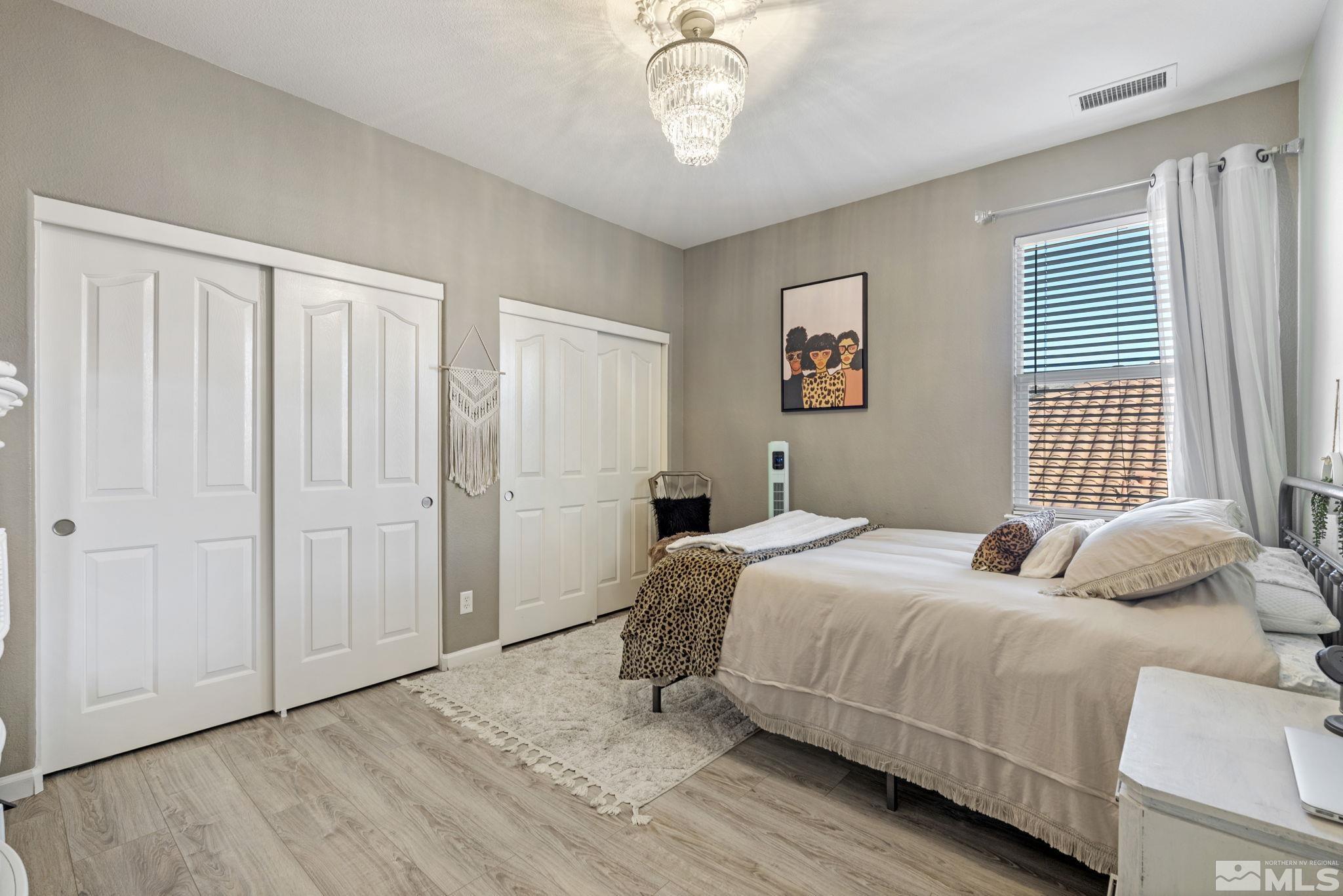 405 Teramo Court Reno, NV 89521 - Photo 26 of 40 a bedroom with a bed and a window