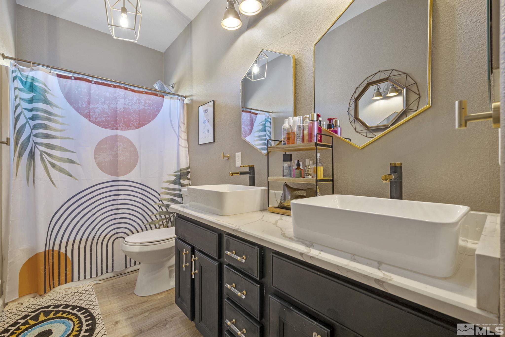405 Teramo Court Reno, NV 89521 - Photo 27 of 40 a bathroom with a sink and a mirror