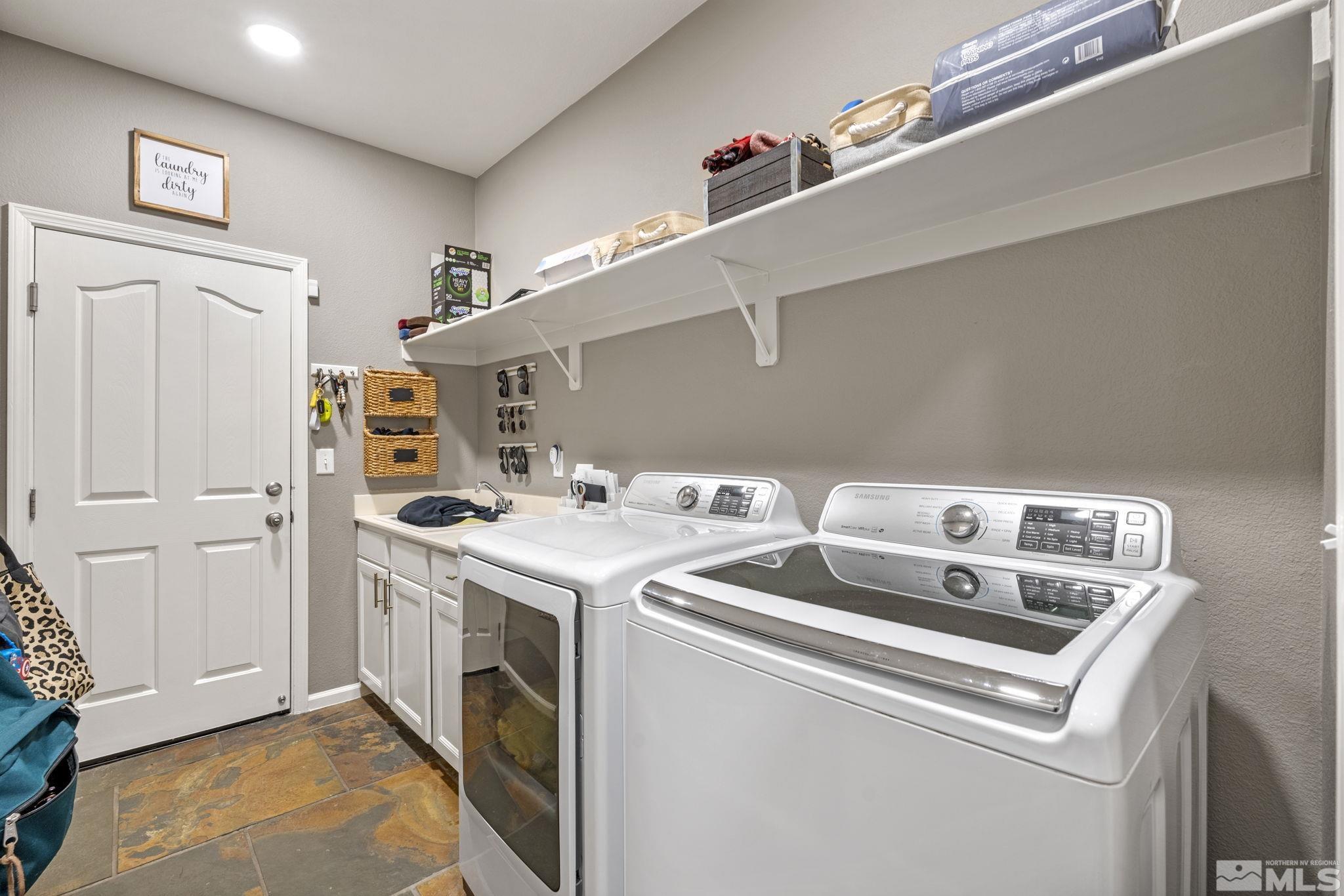 405 Teramo Court Reno, NV 89521 - Photo 30 of 40 a utility room with dryer and washer