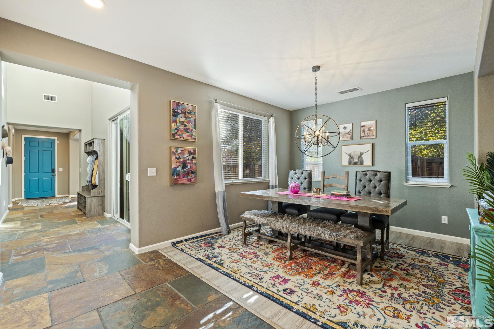 405 Teramo Court Reno, NV 89521 - Photo 3 of 40 a living room with a piano and a table