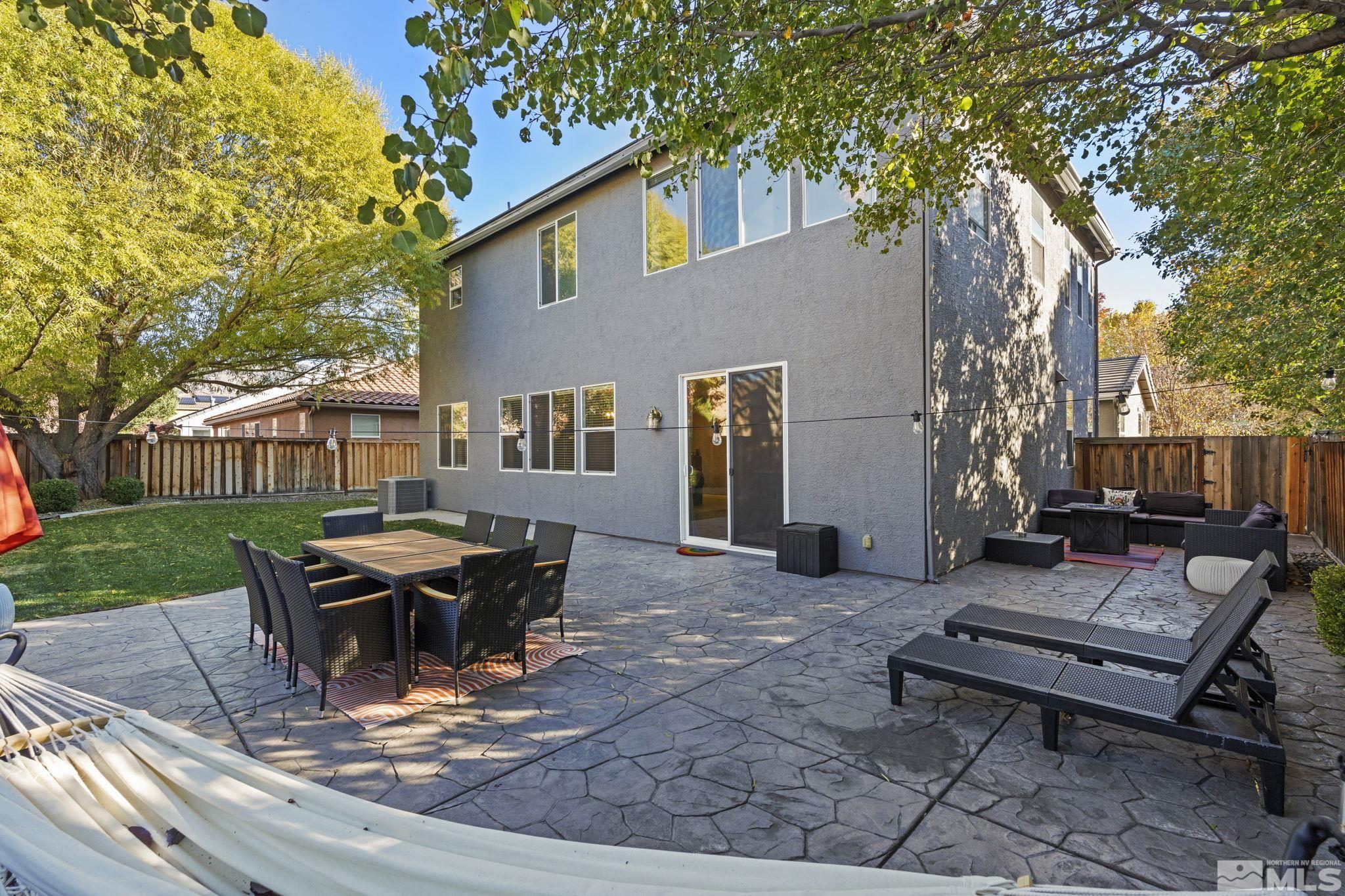 405 Teramo Court Reno, NV 89521 - Photo 32 of 40 a view of a backyard with sitting area
