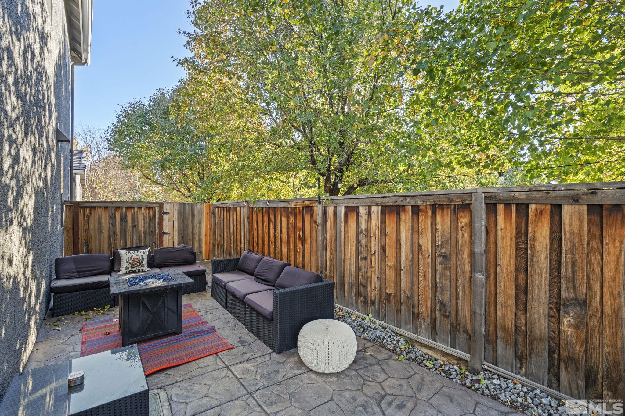405 Teramo Court Reno, NV 89521 - Photo 36 of 40 a backyard of a house with table and chairs