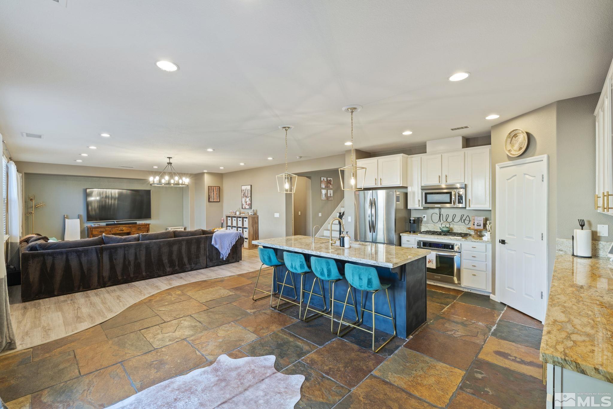 405 Teramo Court Reno, NV 89521 - Photo 9 of 40 a kitchen with stainless steel appliances lots of counter top space