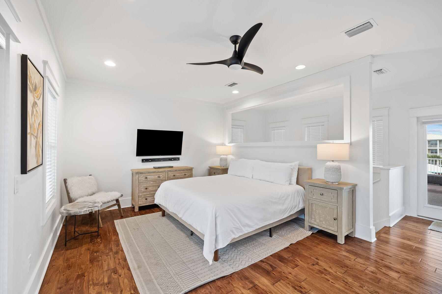 41 West Cobia Run Inlet Beach Inlet Beach, FL 32461 - Photo 18 of 32 a bedroom with a bed and a flat screen tv