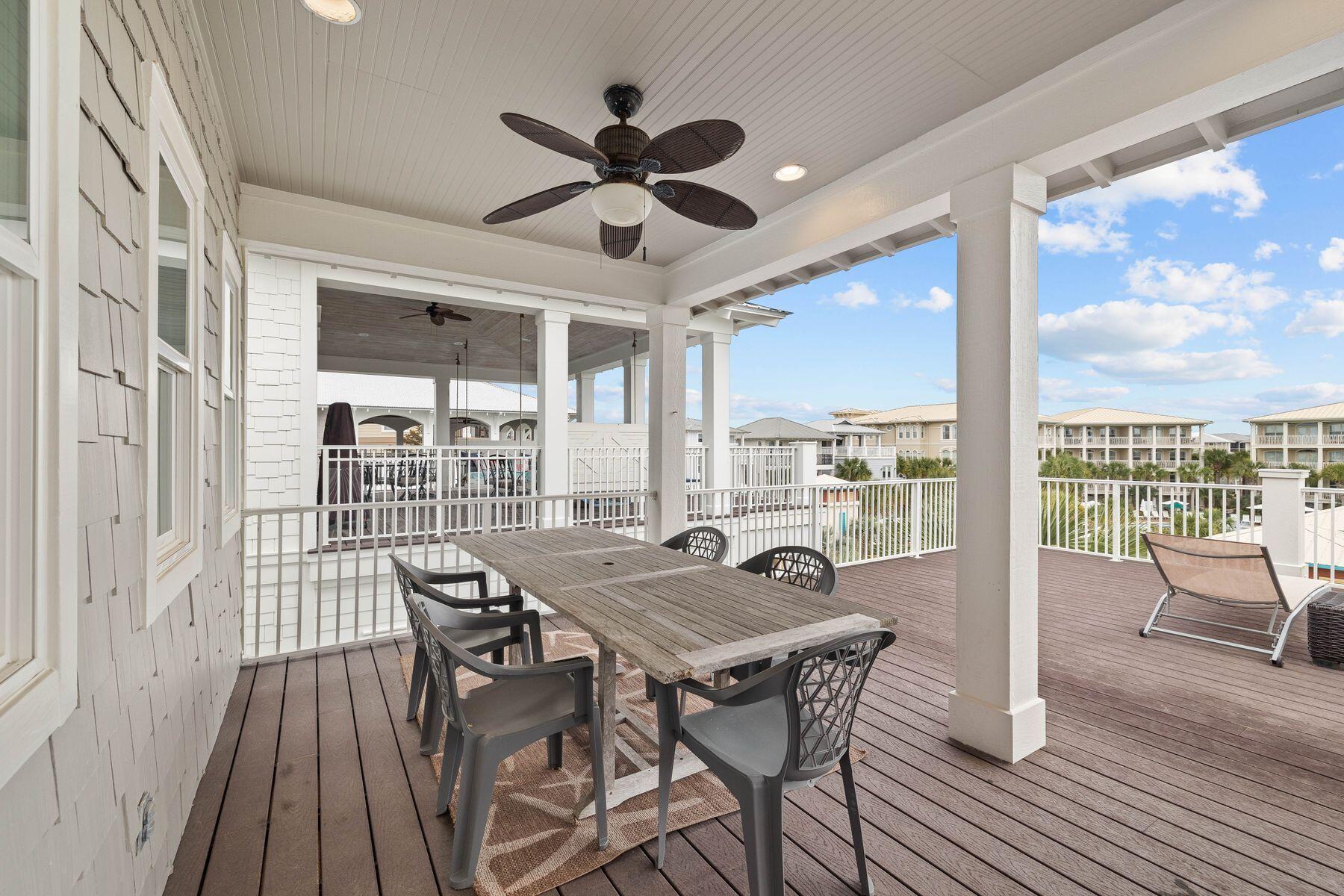 41 West Cobia Run Inlet Beach Inlet Beach, FL 32461 - Photo 21 of 32 a view of a dining room and livingroom with furniture wooden floor a chandelier
