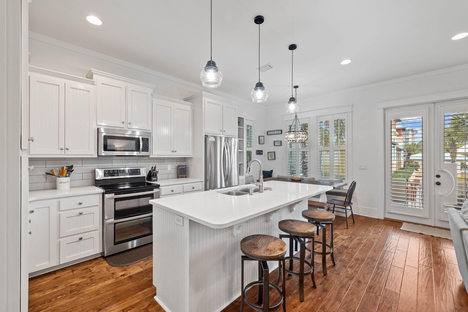 41 West Cobia Run Inlet Beach Inlet Beach, FL 32461 - Photo 8 of 32 a kitchen with stainless steel appliances a stove a sink a refrigerator a center island and a stove