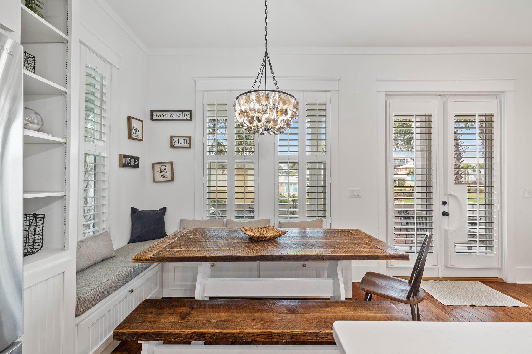 41 West Cobia Run Inlet Beach Inlet Beach, FL 32461 - Photo 9 of 32 a living room with a table and a chandelier